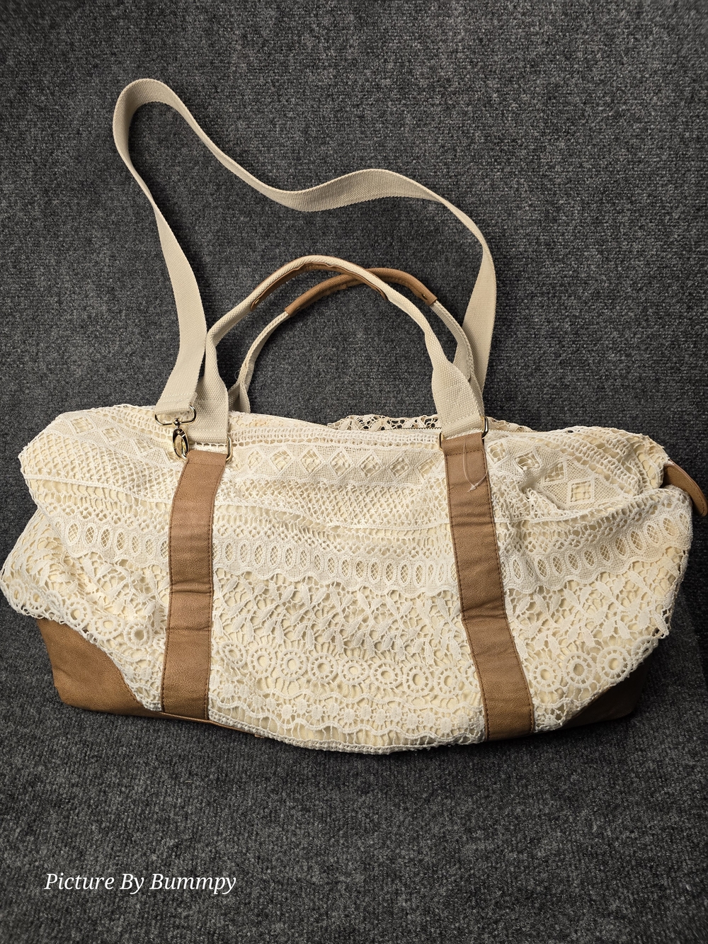 Ivory lace travel bag from Merona features tan faux leather trim